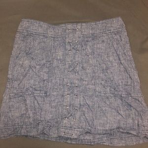 Mini skirt with cross stitch detailing.